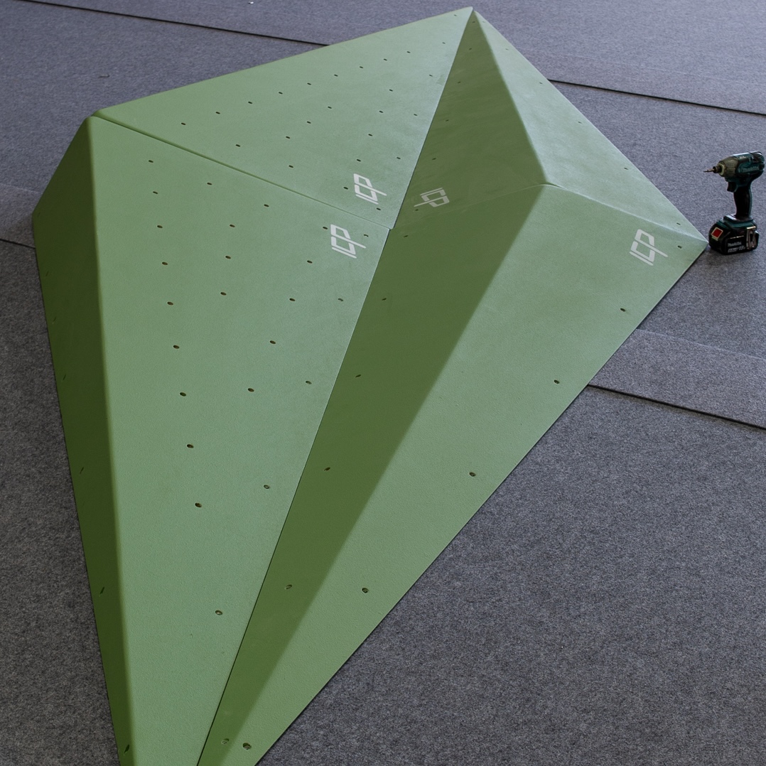 Grace.G2.3.L_ICP Volume - Climb ICP Shop Australia Two Grace.G2.3.L ICP Volumes in green, resting on grey safety matting and ready for route setting on a climbing wall.