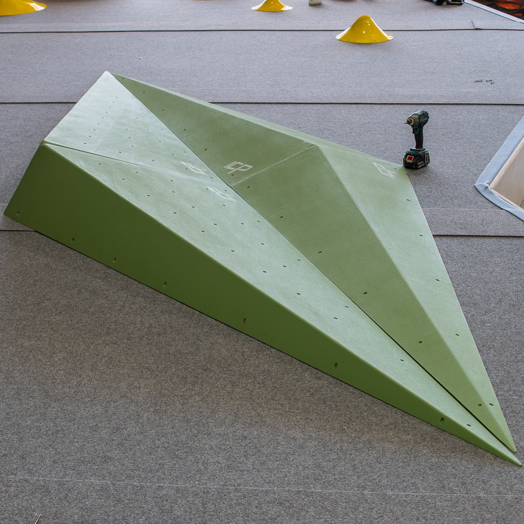 Grace.G2.4.L_ICP Volume - Climb ICP Shop Australia Two Grace.G2.4.L ICP Volumes in green, placed on safety mats and ready for route setting on a climbing wall.