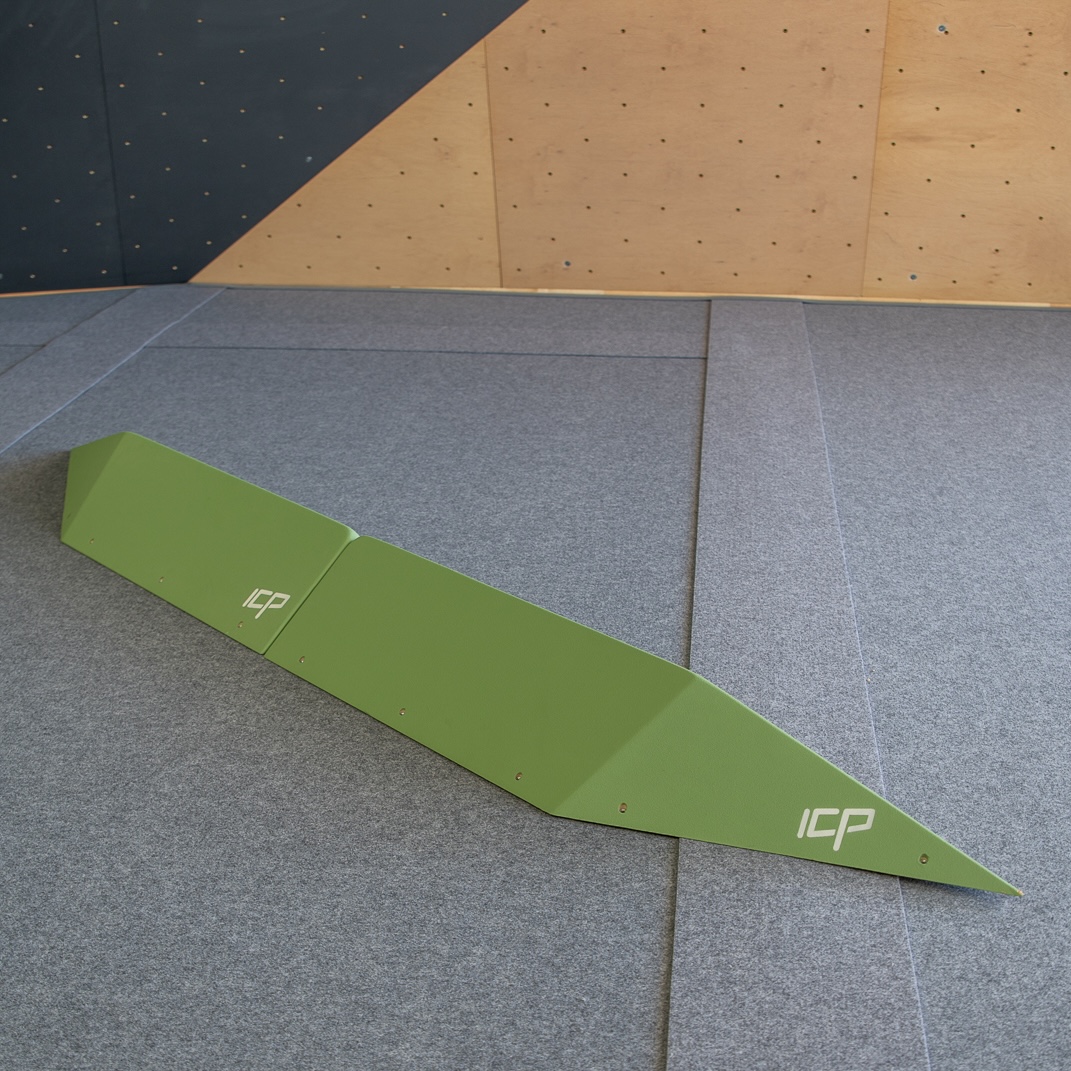 Harry.H2.4-5.L_ICP Volume - Climb ICP Shop Australia Large green ICP Harry H2.4-5 L thin rail climbing volume pair with t-nuts, mounted on a wood-textured wall for technical route setting.