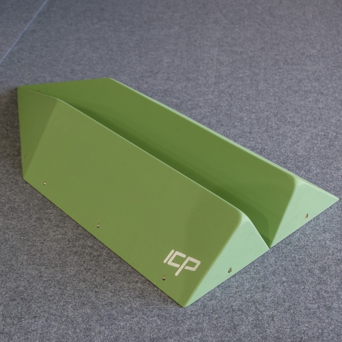 Medium green ICP Holly H1.4-5 M climbing volume pair on safety matting, with both parts displayed side by side before installation.