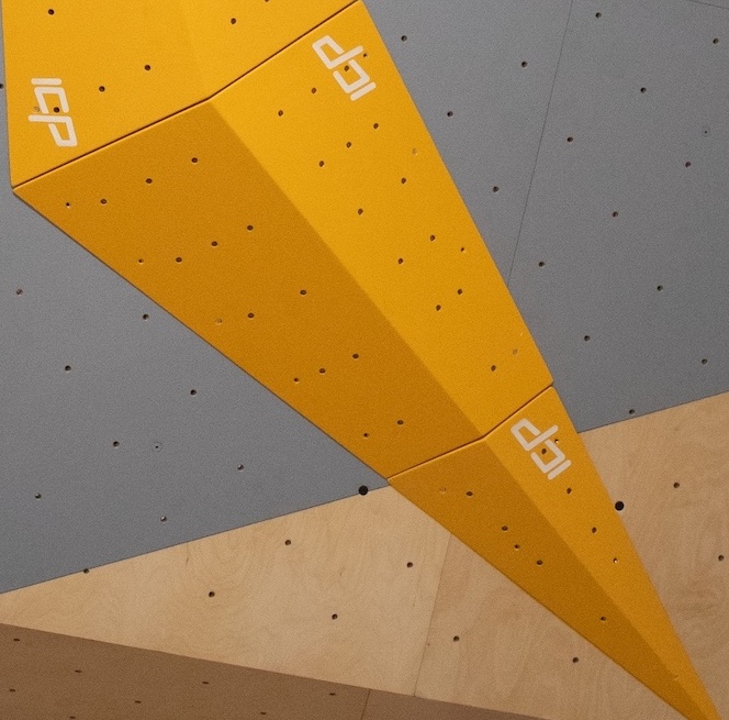 ICP Volumes - (G2.1 Part 1 Part 2)-128 - Climb ICP Shop Australia (G2.1 Part 1 Part 2)-128 yellow ICP Volume mounted on a wood-textured and grey bouldering wall.