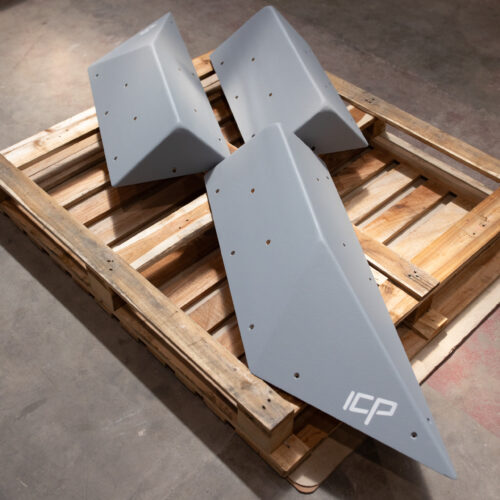 Complete grey ICP Holly H1.1-2-3 L climbing volume set with all three sections, stacked on a pallet before installation.