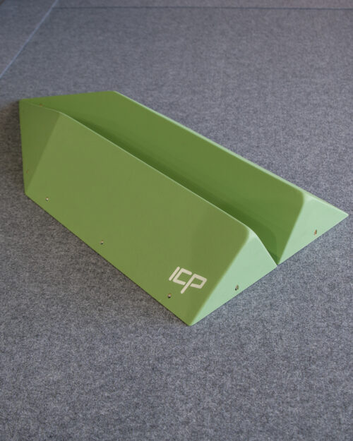 Medium green ICP Holly H1.4-5 M climbing volume pair on safety matting, with both parts displayed side by side before installation.