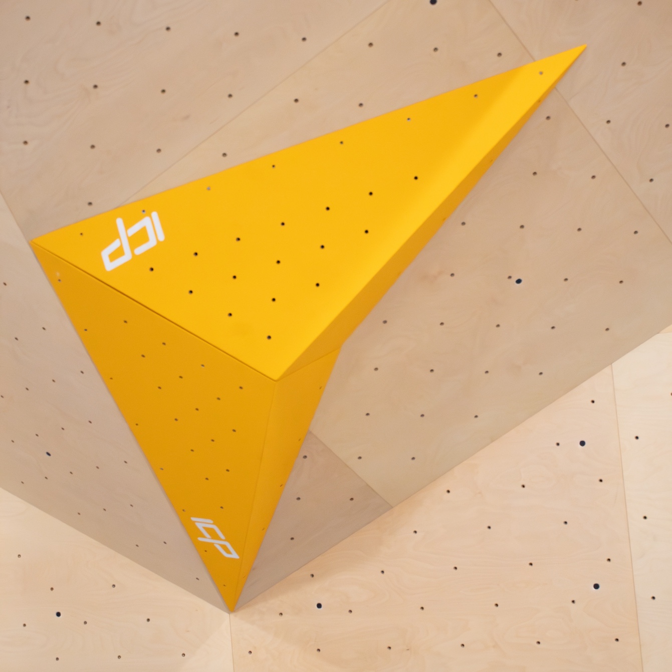 Lily.L2.1-2.XL oversized arrowhead ICP Volume mounted on an indoor climbing wall for bold, volumes-based route setting.