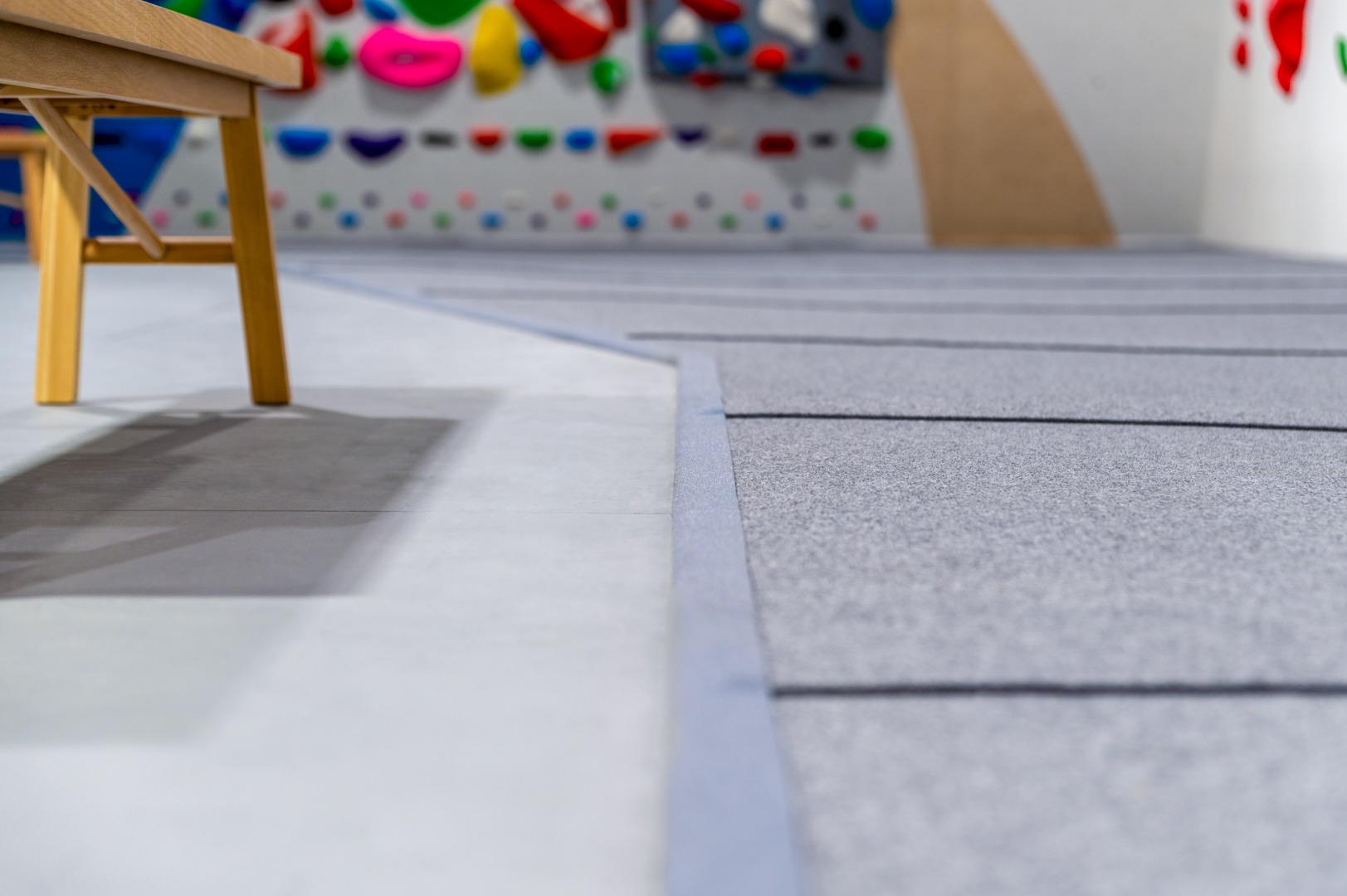 A gym built by ICP with seamless grey climbing mats.