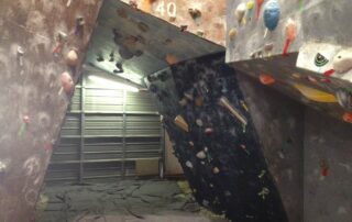 A climbing gym with old matting