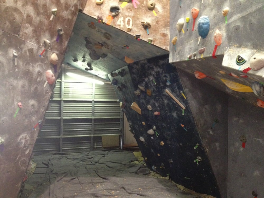 A climbing gym with old matting