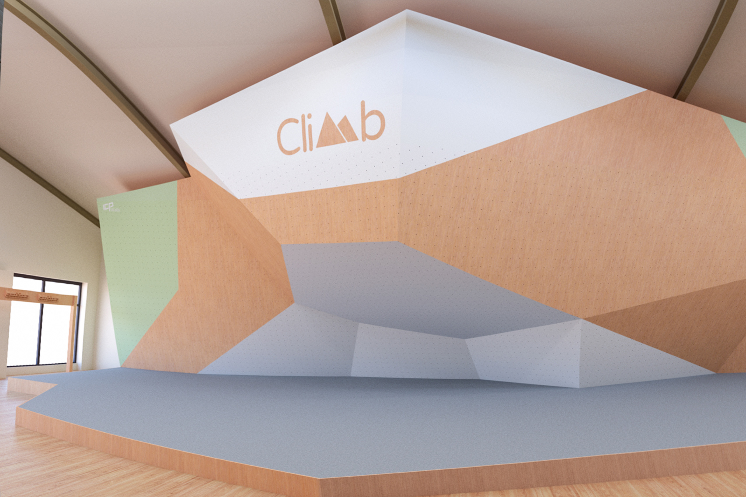 ICP climbing walls before holds are added, with green and white painted surfaces, wood texture panels, and grey safety bouldering mats.